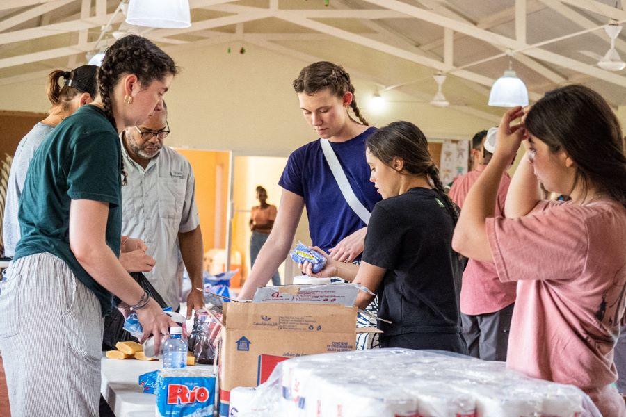 Baylor pre-physician assistant students sort medical supplies during a mission trip to the Dominican Republic.