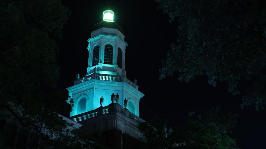 Baylor University's Pat Neff Hall is lit in the color teal in support of Sexual Assault Awareness Month.