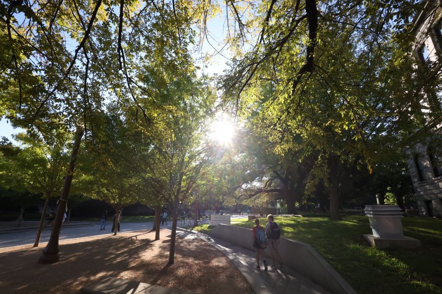 Students walking on campus Carroll Science Building