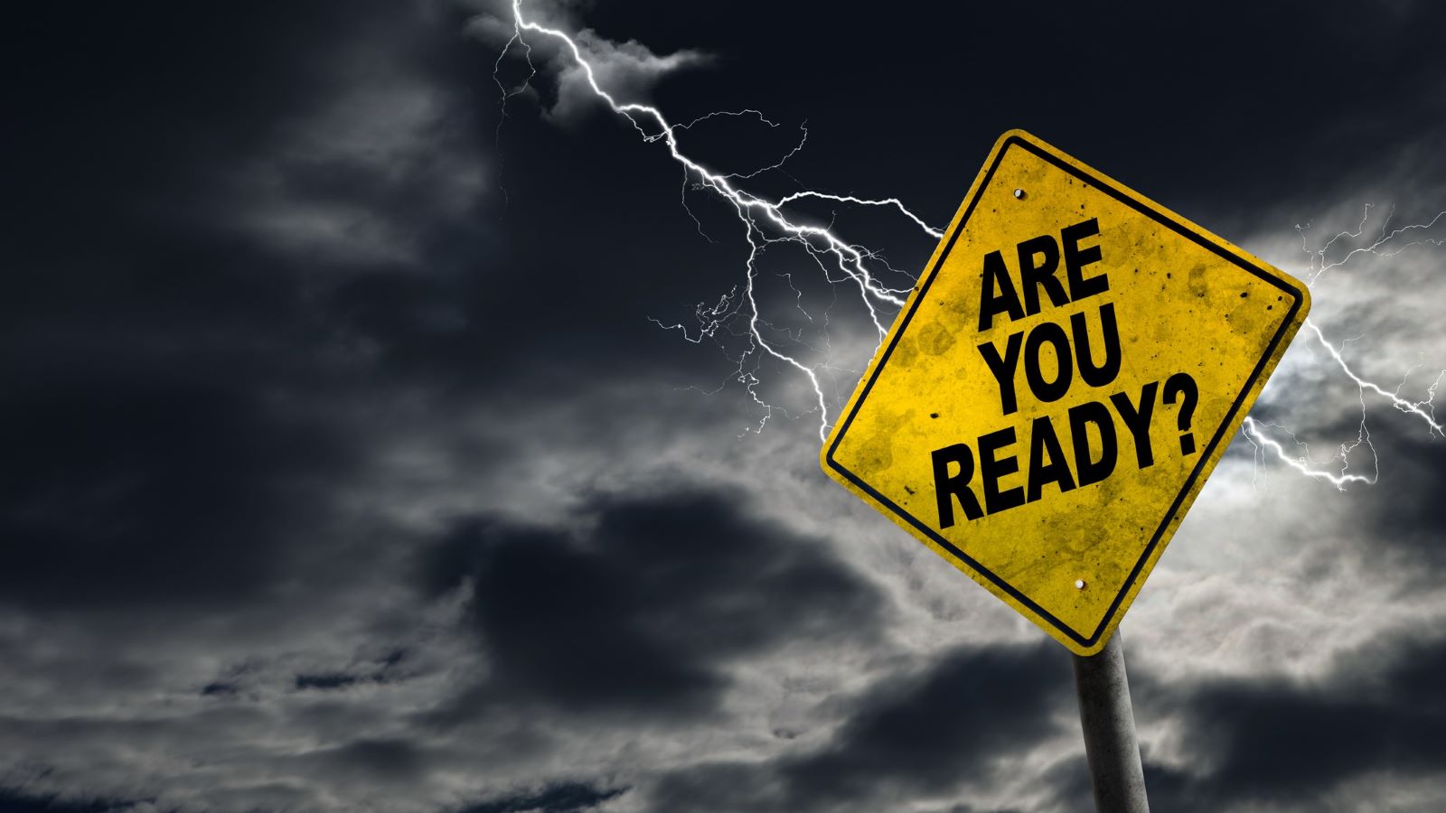 Sign that reads "Are You Ready?" with lightning and dark skies in the background