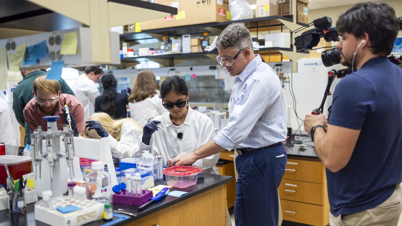 Baylor chemist Bryan Shaw works with students who have blindness or low vision to participate fully in a chemistry lab