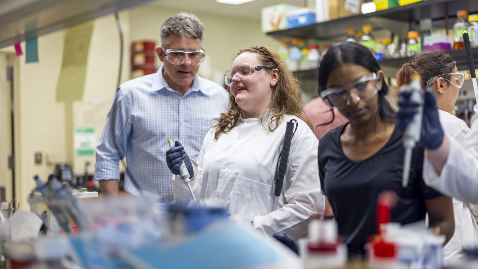 A high-school student with the Texas School for the Blind and Visually Impaired conducts a chemistry experiment in the lab of Baylor chemistry professor Bryan Shaw.