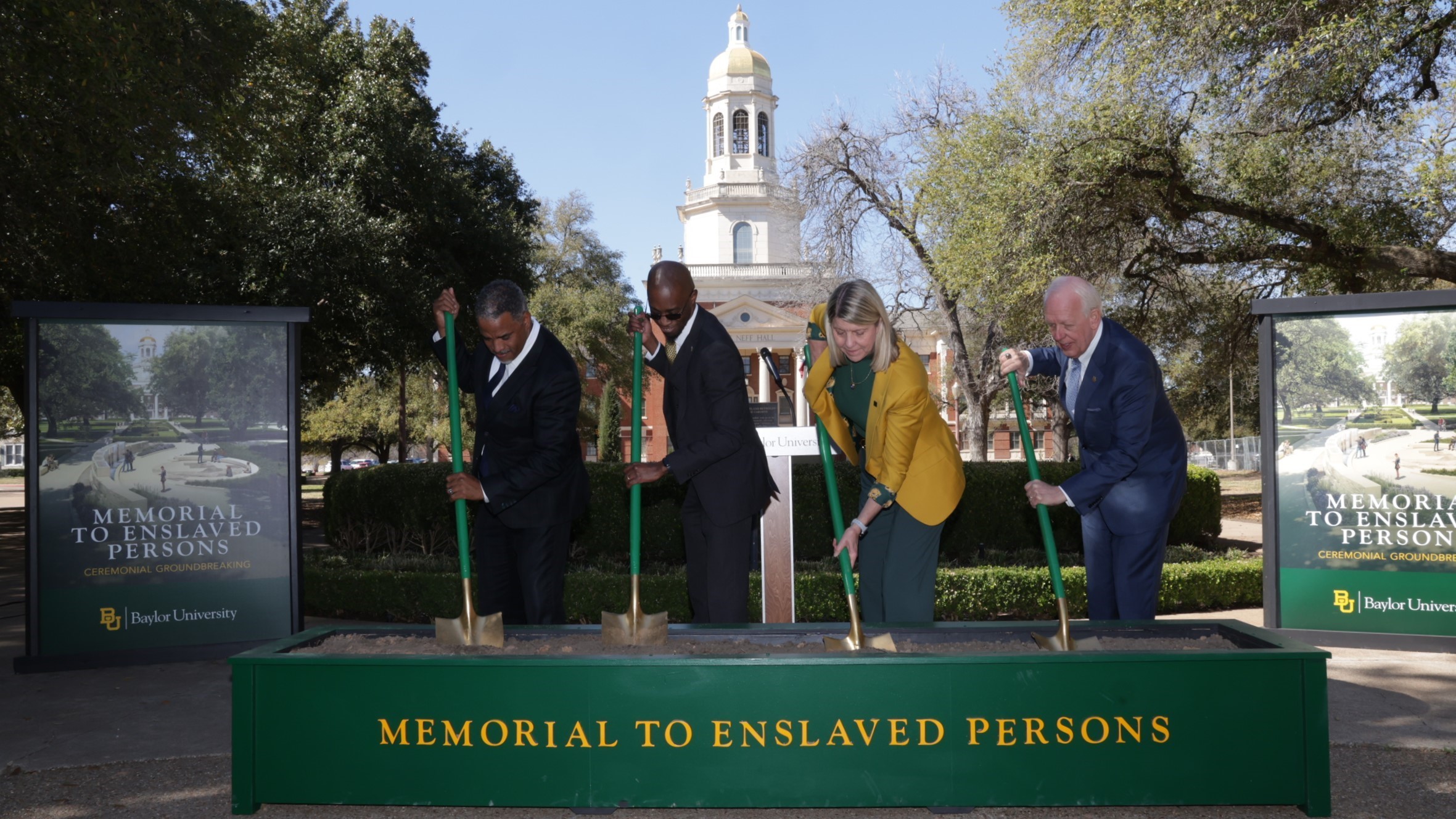 Baylor Regents, Commission Members and University Leadership perform a ceremonial "turning of the dirt" during the groundbreaking for the Memorial to Enslaved Persons.