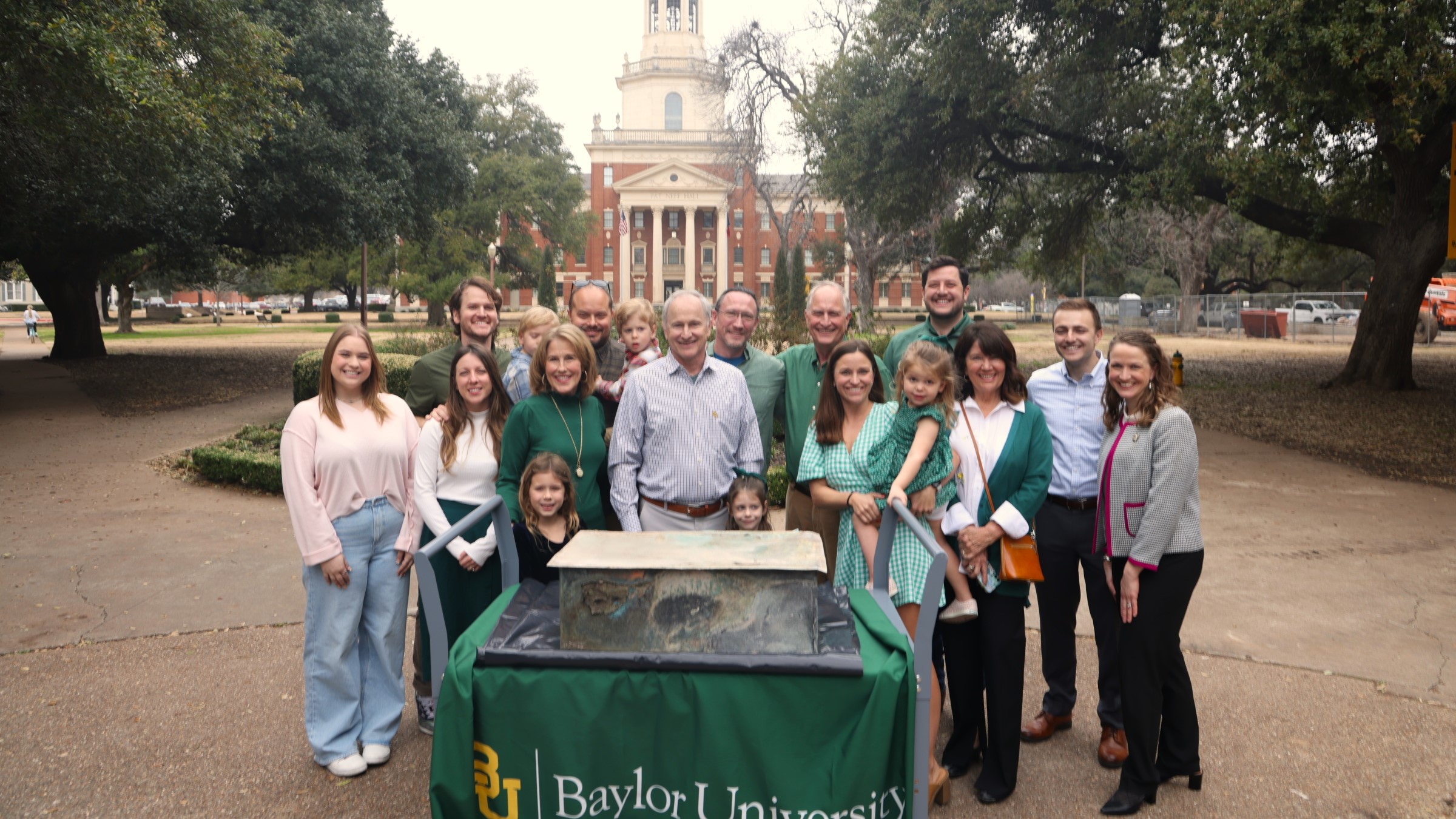 Family members of Catherine Collins, Baylor Class of 1945, Baylor student government officers and Texas Collection representatives stand behind the Centennial Time Capsule box.