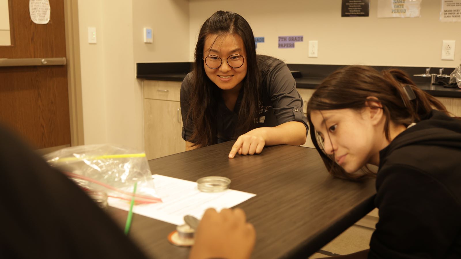 Yang Li, Ph.D., assistant professor of environmental science at Baylor, leads students at G.W. Carver Middle School in Waco on a STEM Day experiment on air quality and human health.