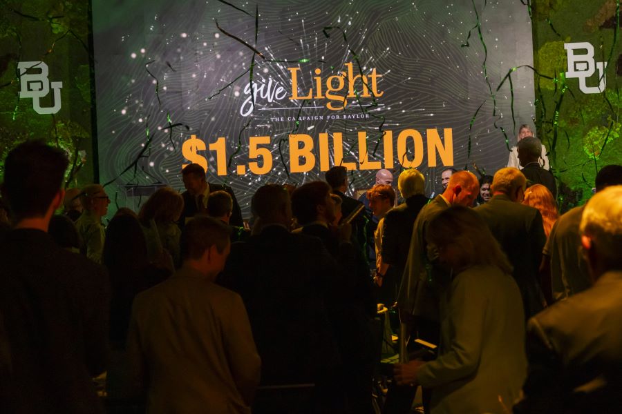 Colorful confetti on a green screen celebrating $1.5 billion raised in the Give Light Campaign