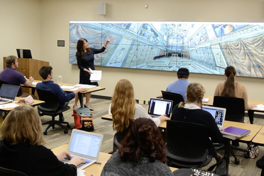 Dr. Heidi J. Hornik is professor of art history and chair of the Department of Art & Art History at Baylor University, shown here teaching students about a piece of Renaissance art
