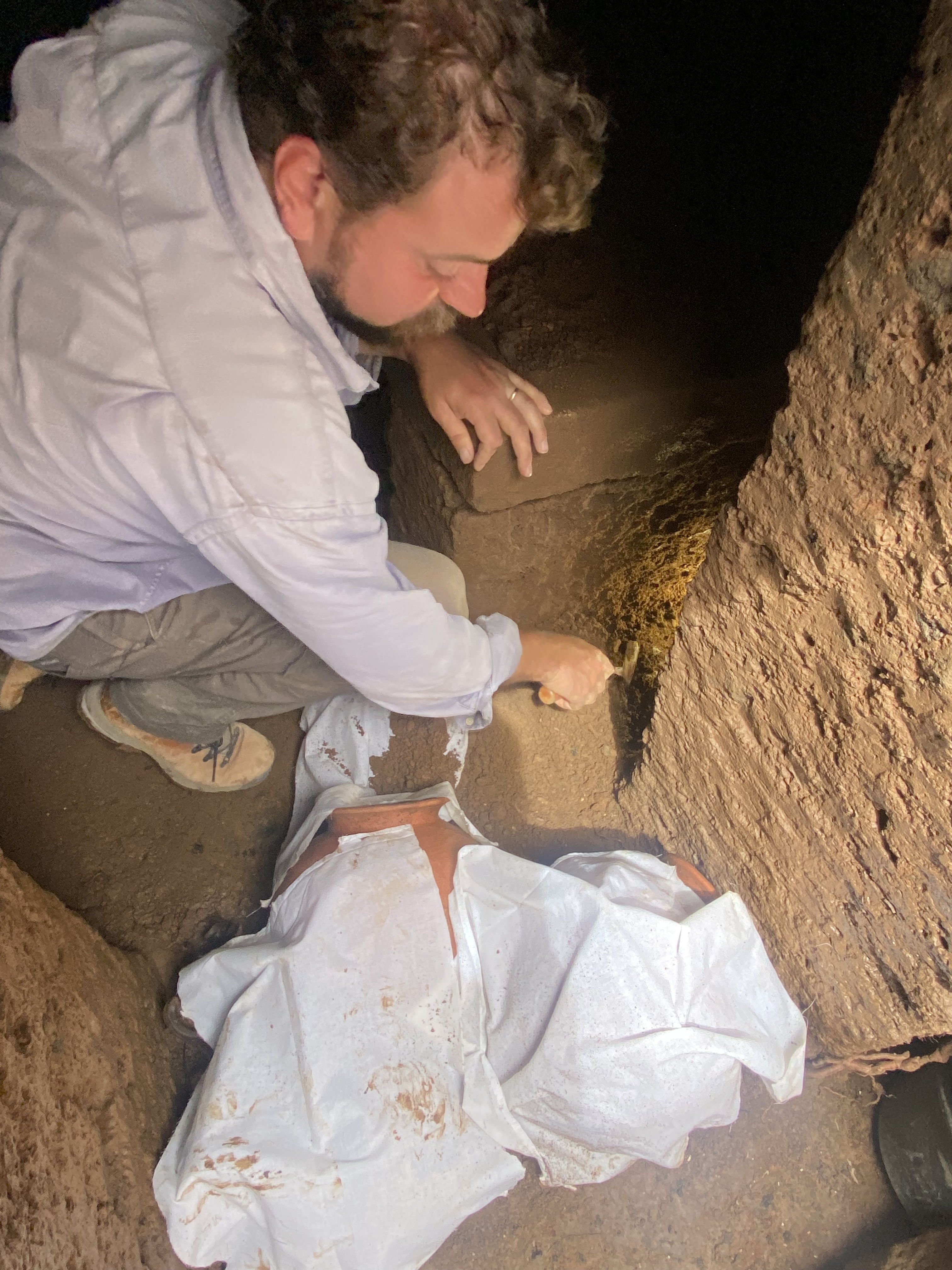 Davide Zori, Ph.D., recovers items from the Etruscan tomb.