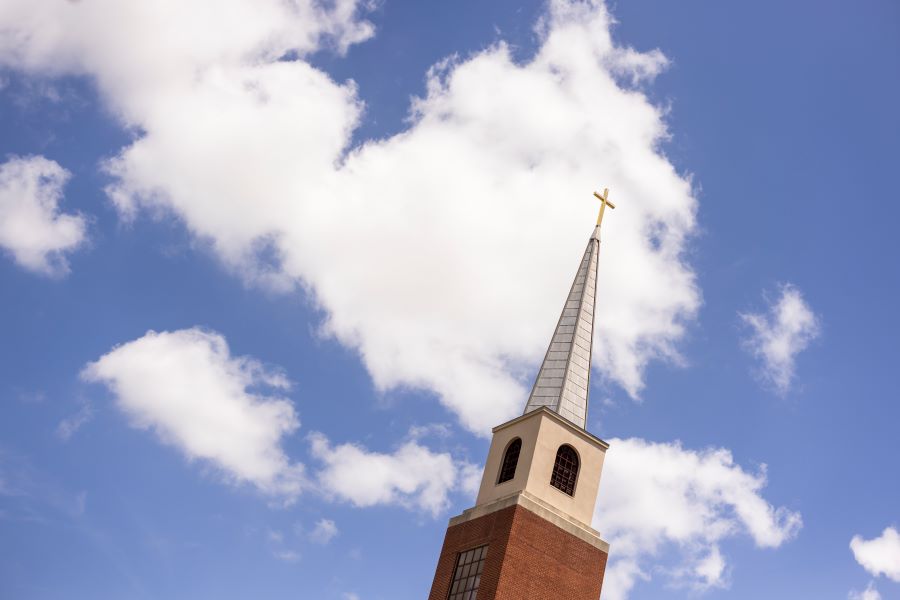 Truett Seminary Chapel steeple among blue skies and clouds