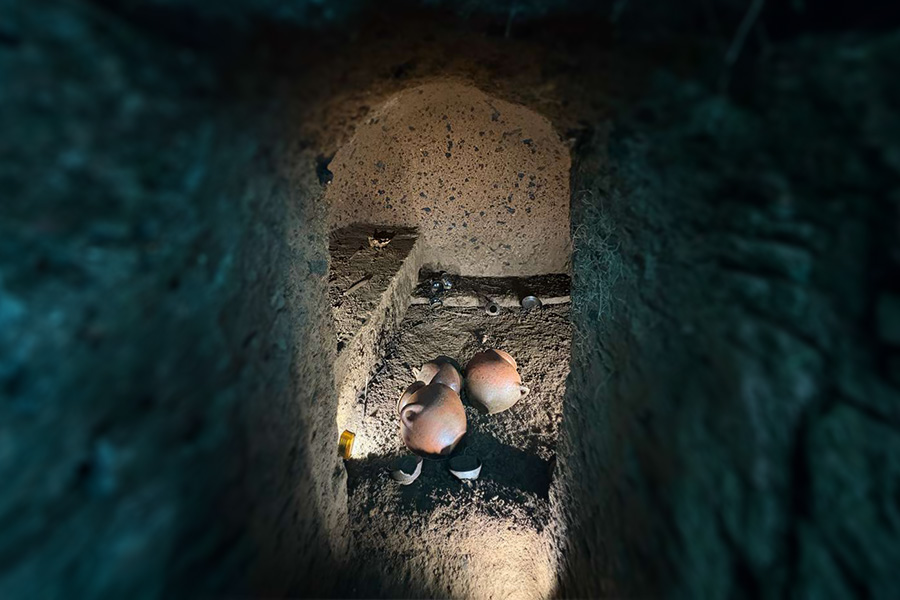 looking into doorway of intact Etruscan chamber tomb 