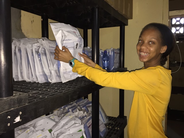 Moriah Dadson works in hospital inventory storage room
