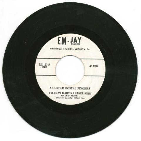 A 45 RPM record with a cream-colored label