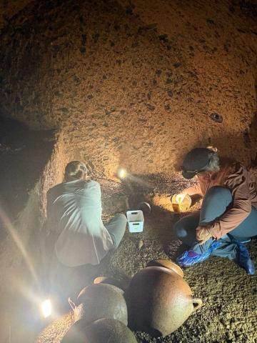 Aprille and Morrison excavating inside newly discovered tomb