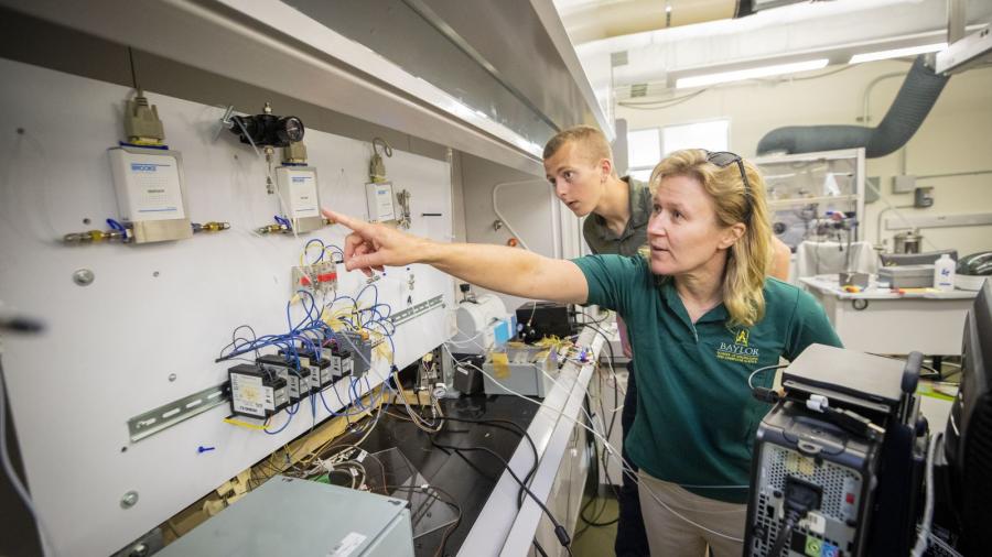 Annette von Jouanne, Ph.D., Professor of Electrical and Computer Engineering, working with a student in her lab.