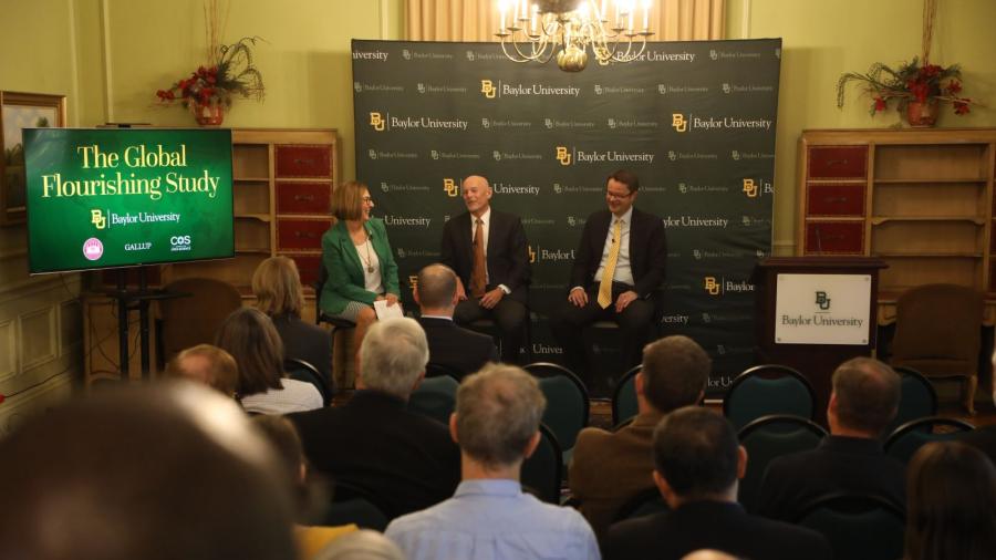 Baylor and Harvard professors sitting in chairs discuss the research project, the Global Flourishing Study