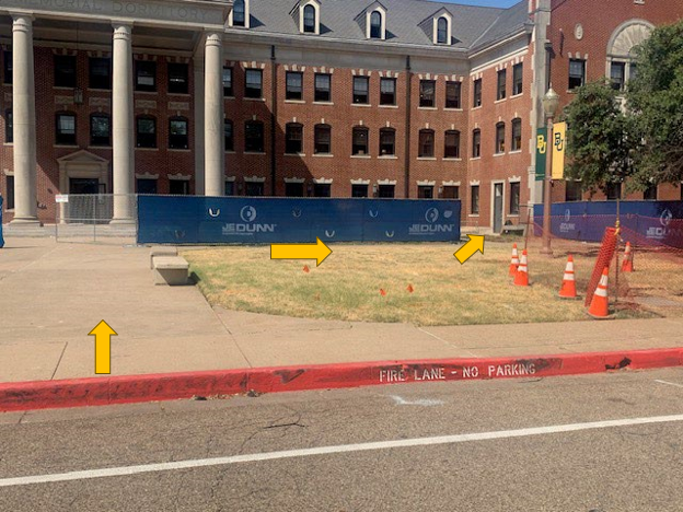 Arrows in front of Memorial Hall direct patrons to the right to a Memorial Dining temporary entrance.