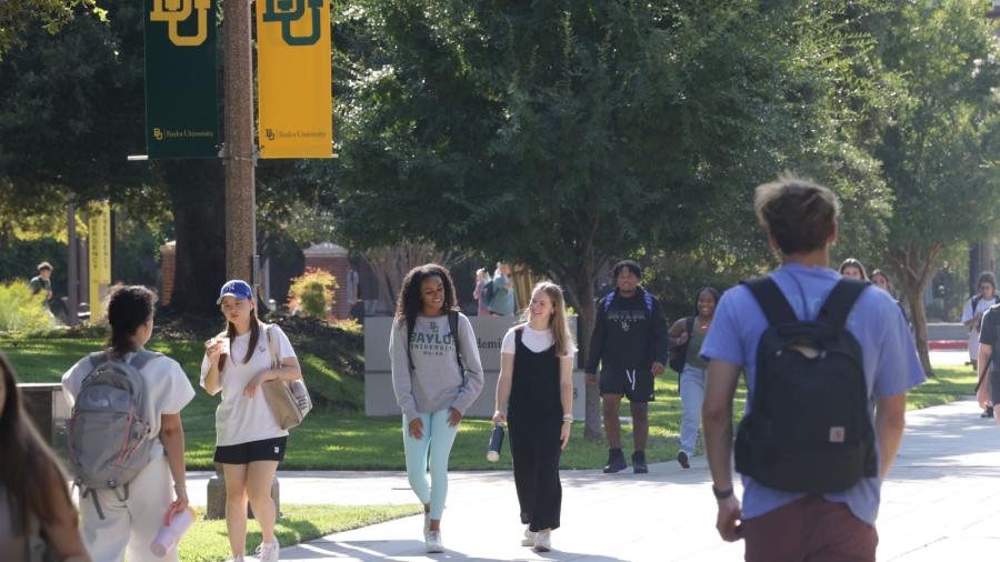 Baylor University students on campus walking to class 