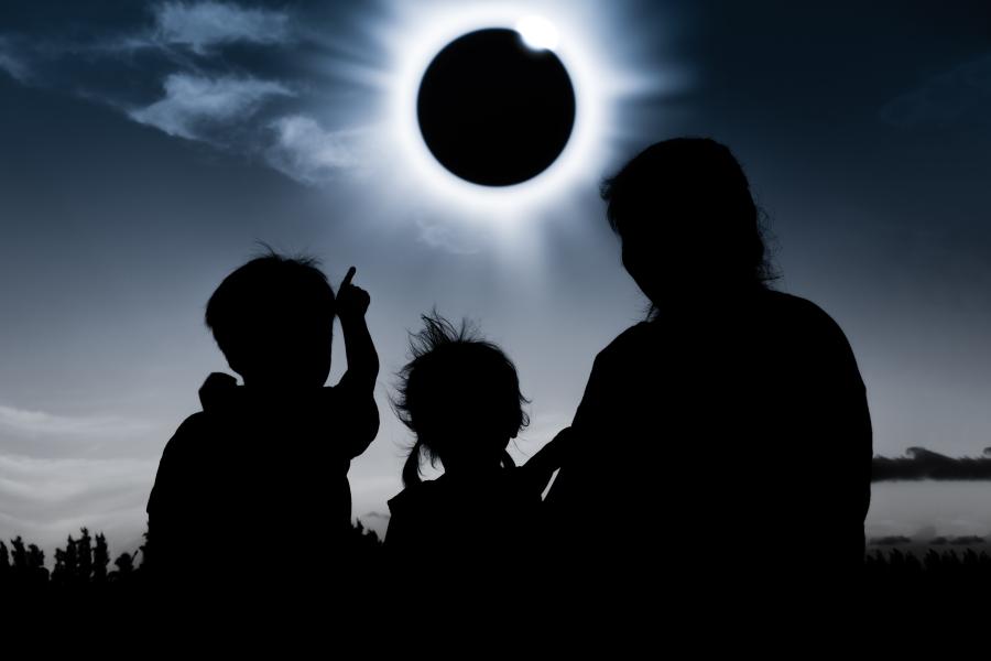 Family viewing a total eclipse.