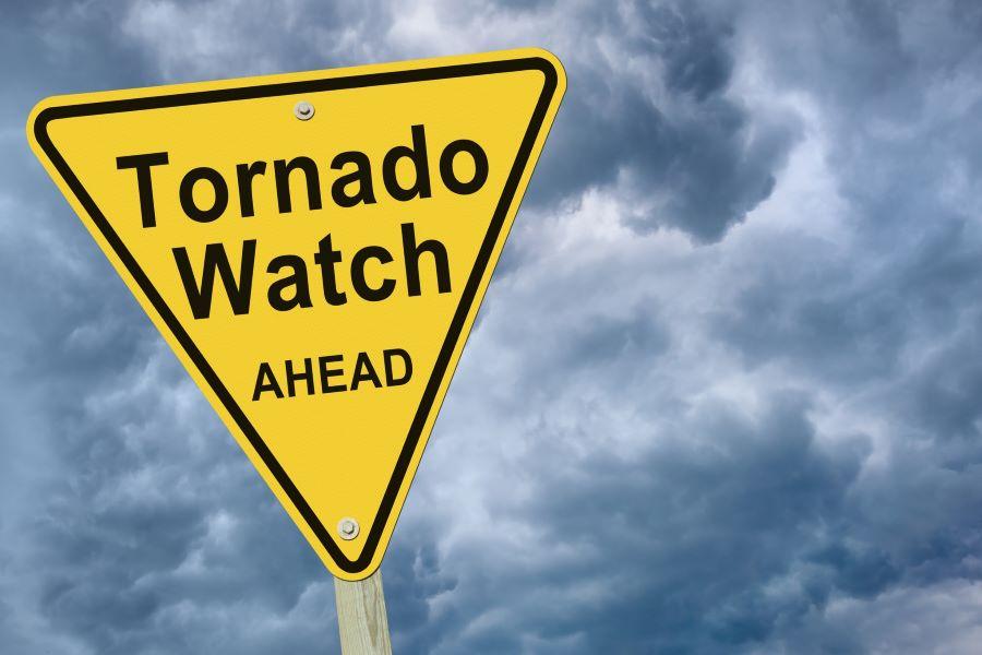 Yellow warning sign Tornado Watch Ahead with stormy skies