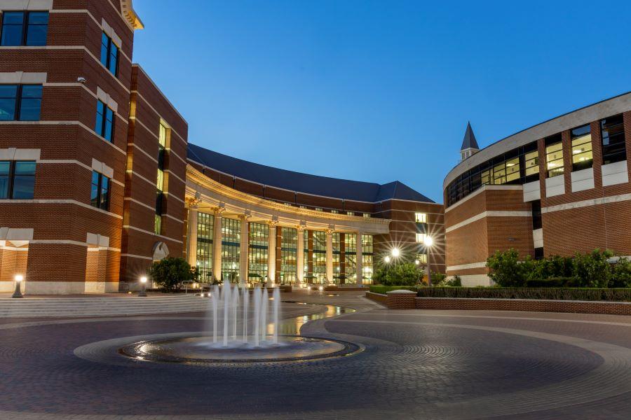 Baylor Sciences Building and one of its water fountains at dusk