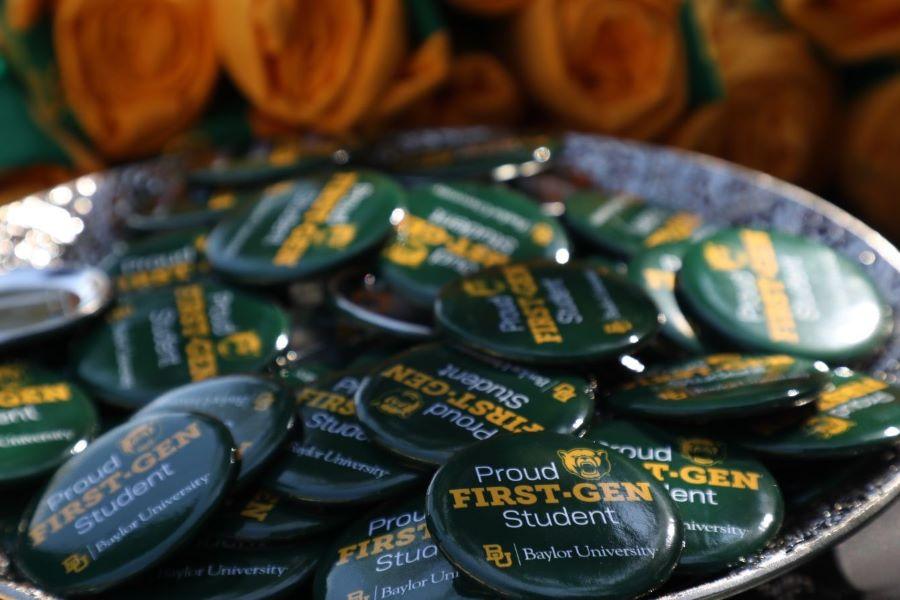 Bowl of green buttons that say Proud First-Gen Student at Baylor