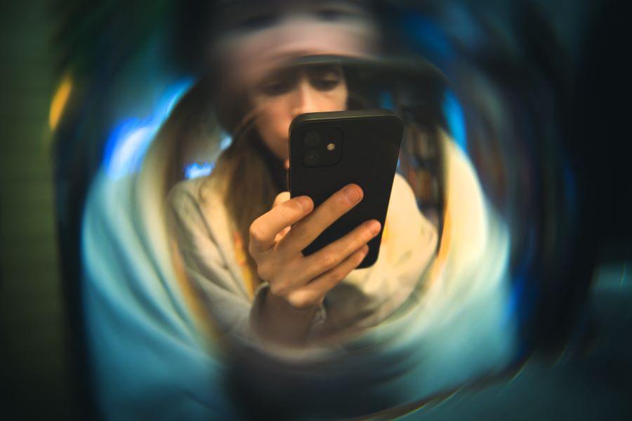 woman staring at phone