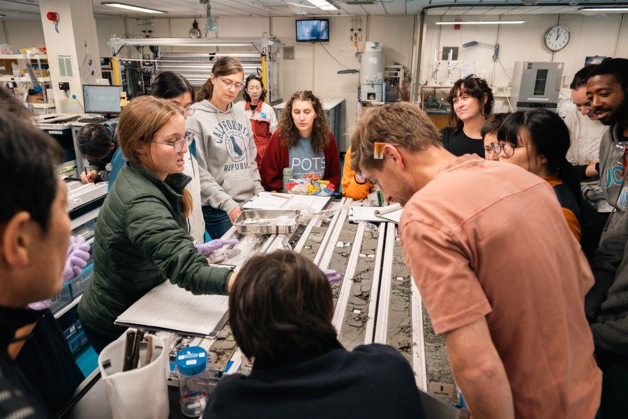 Cat Ross, Ph.D. studies sediment from the plate boundary fault of the coast of Japan. (Photo credit: Dorianne Lexetier)