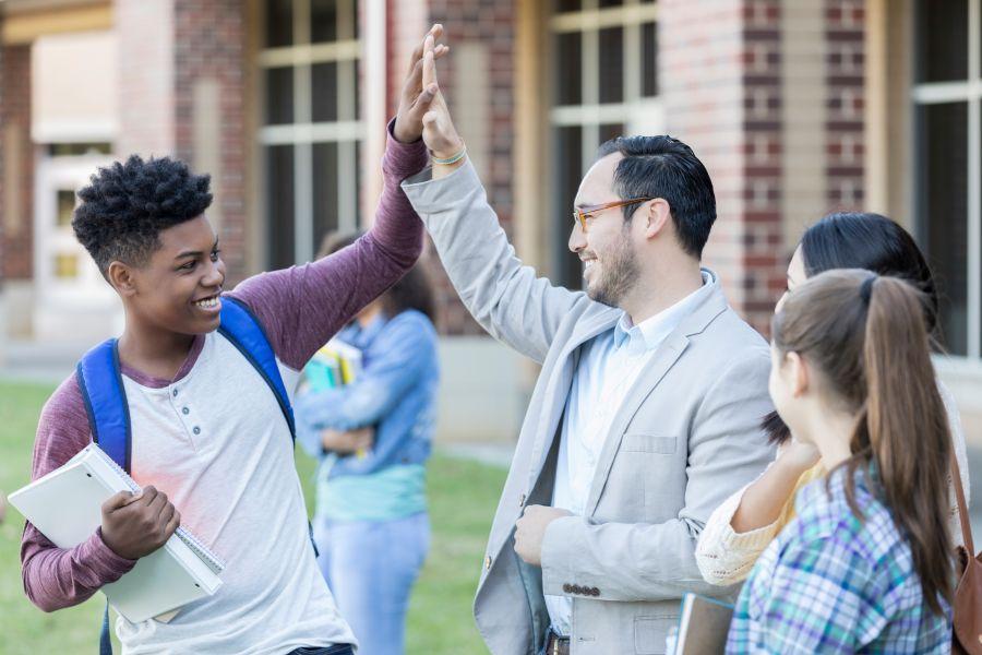 Principal interacts with students