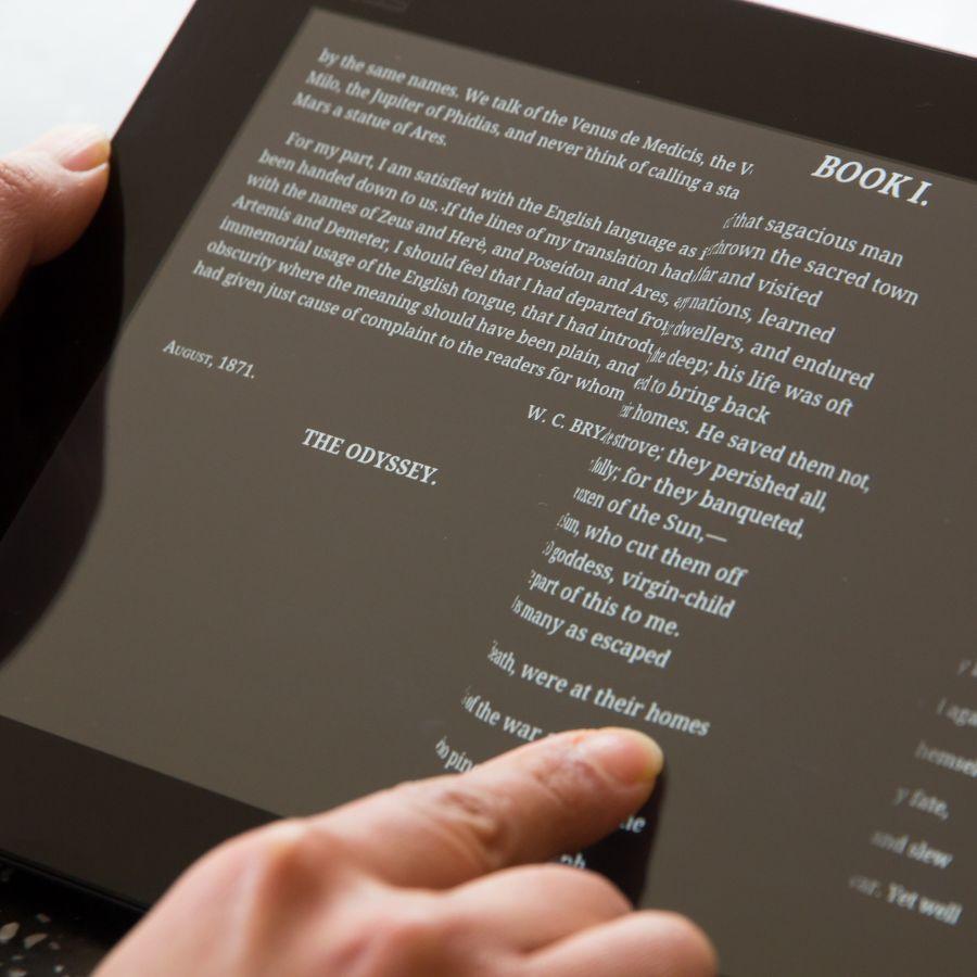  Woman reading the classic Greek poem The Odyssey on a tablet computer 