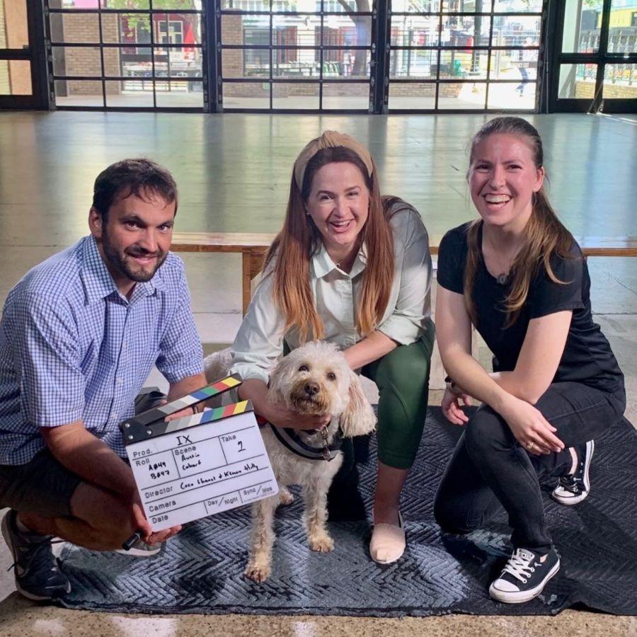 Photo left to right of the Greats Story Lab team: Denton Adkinson (director of photography), SJ Murray (founder), Courtney Becker (line producer), and in the middle Coco Chanel (set mascot).