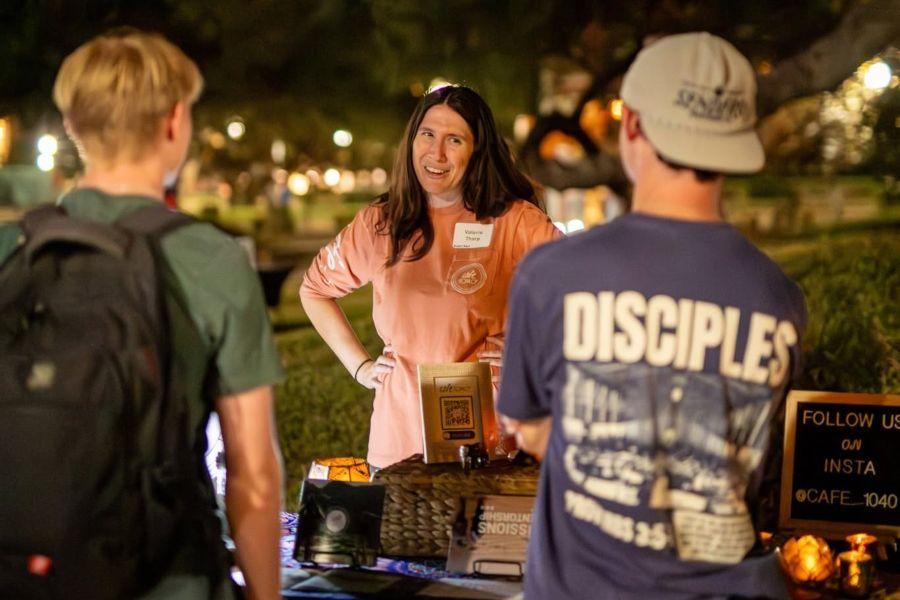 Two students speak with a global missions partner during Missions Week on the Baylor University campus